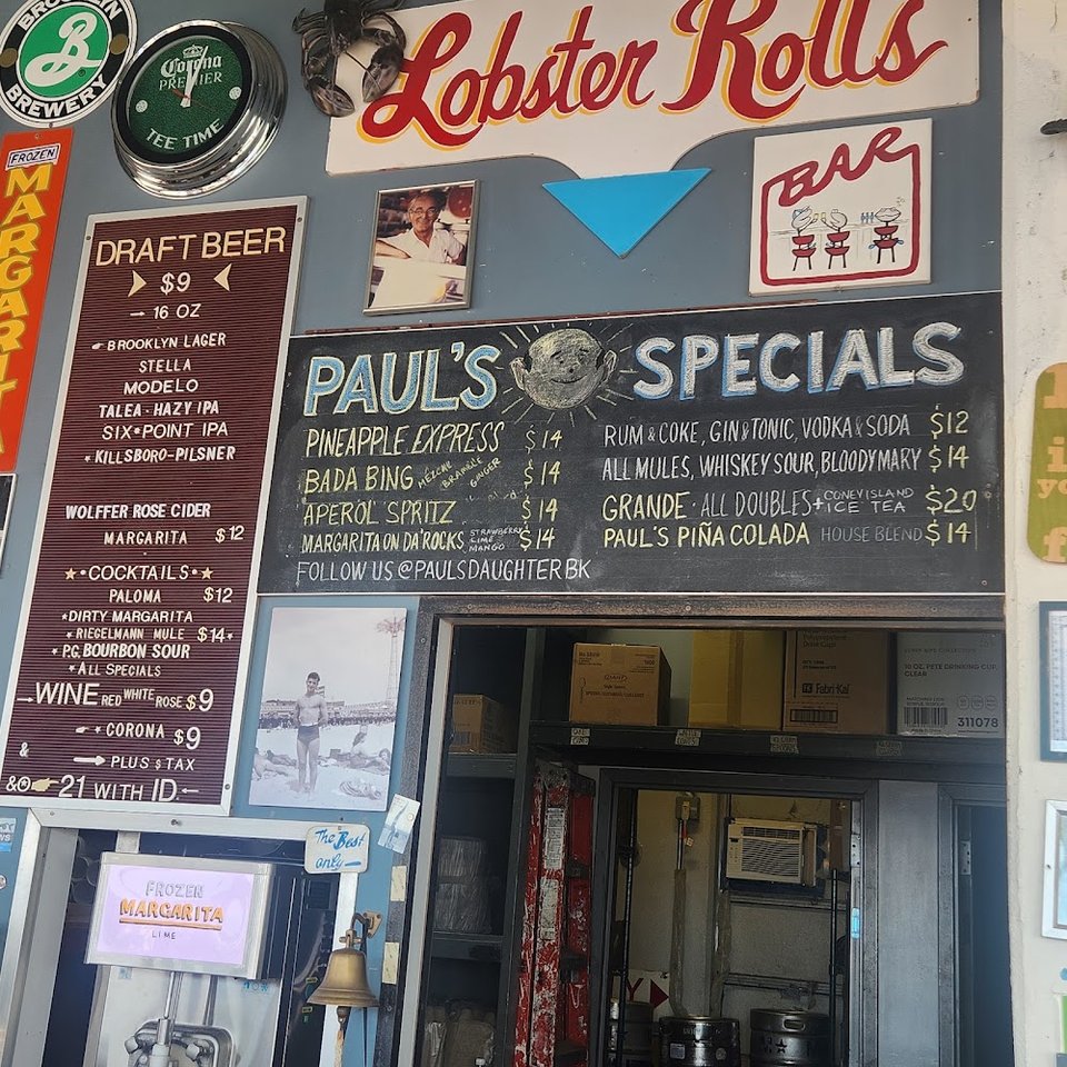 Printed menu featuring seafood, fries, and franks.
